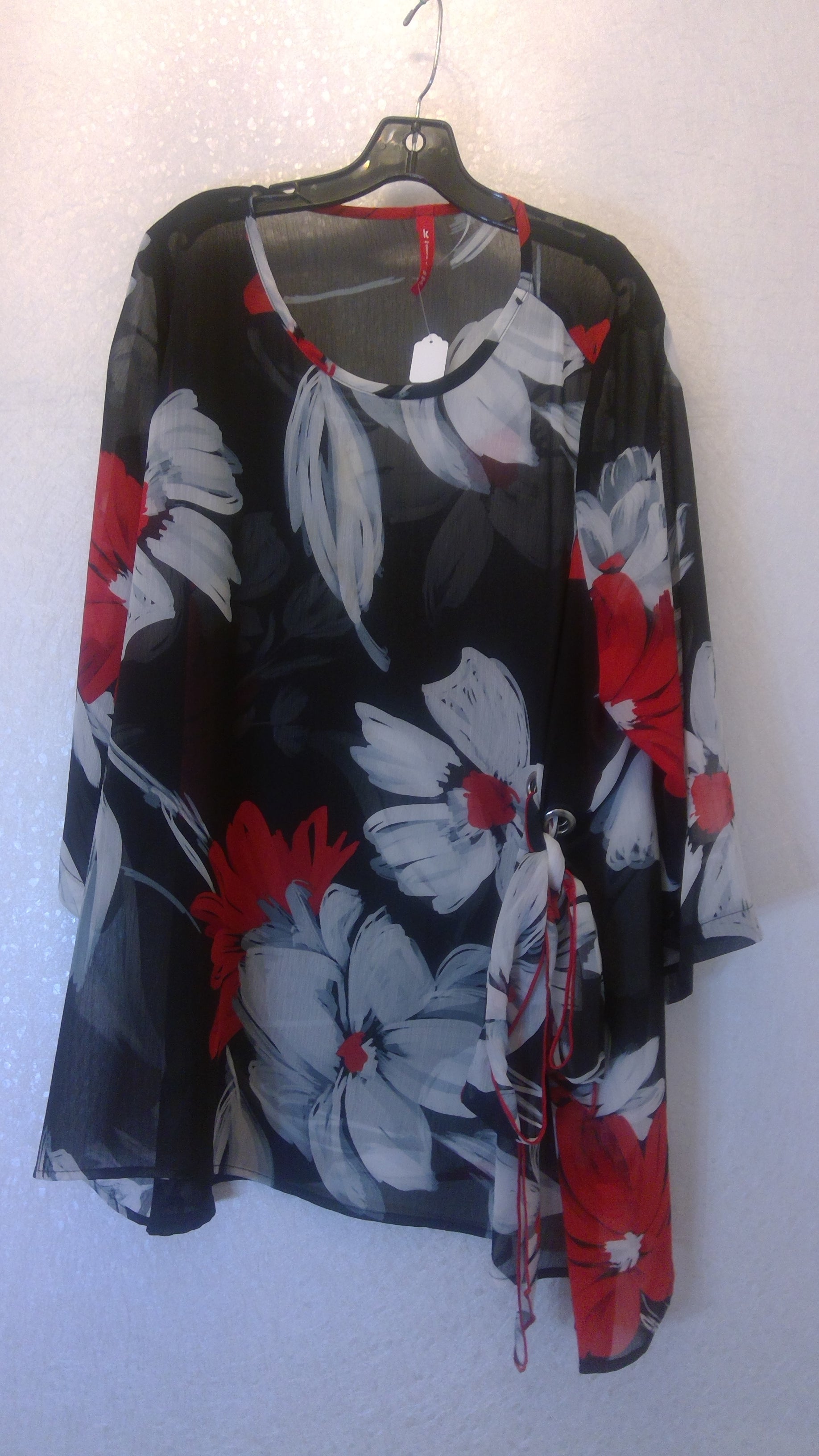 Floral-patterned jacket with red, white, and black colors