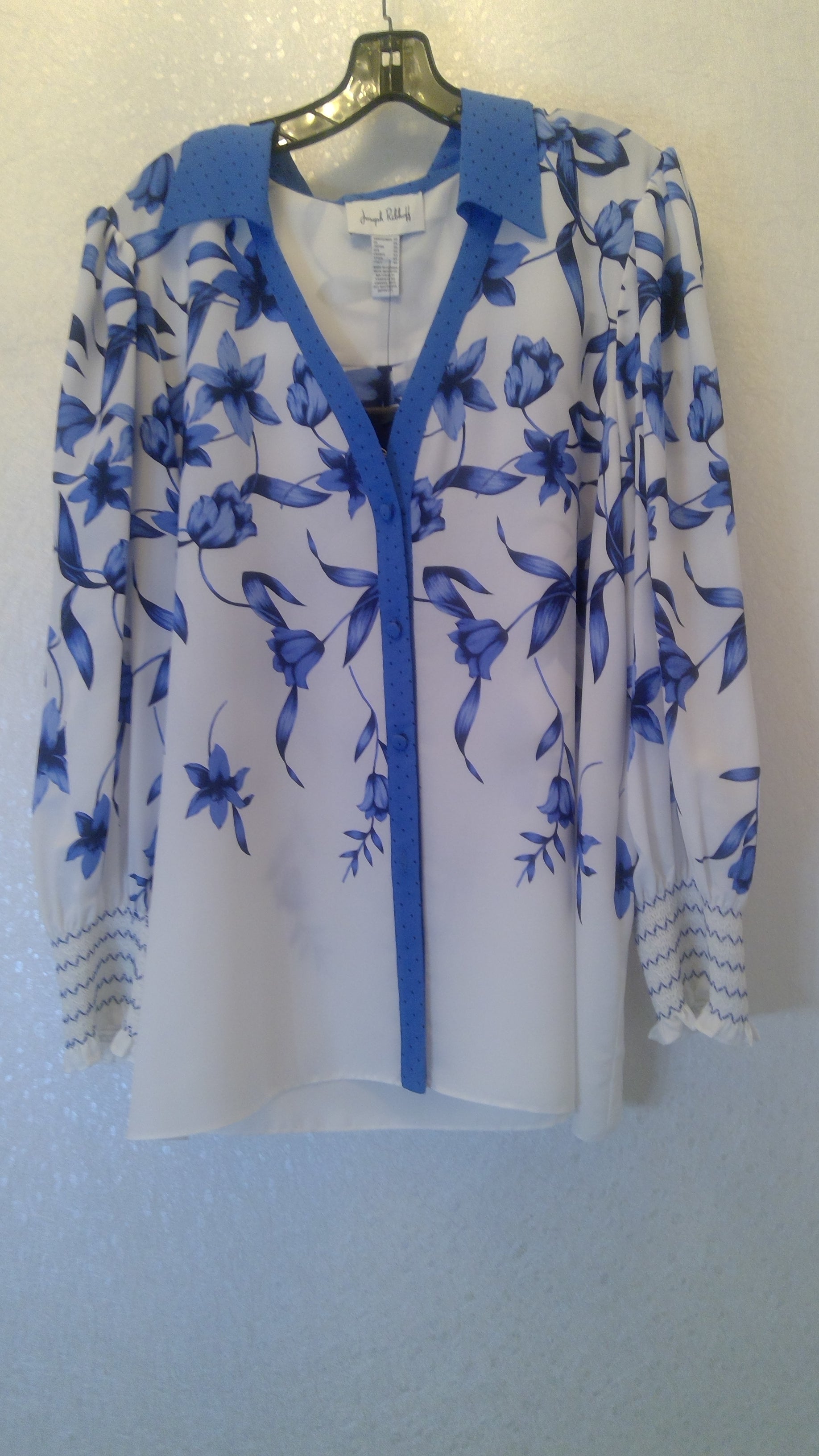 White blouse with blue floral pattern