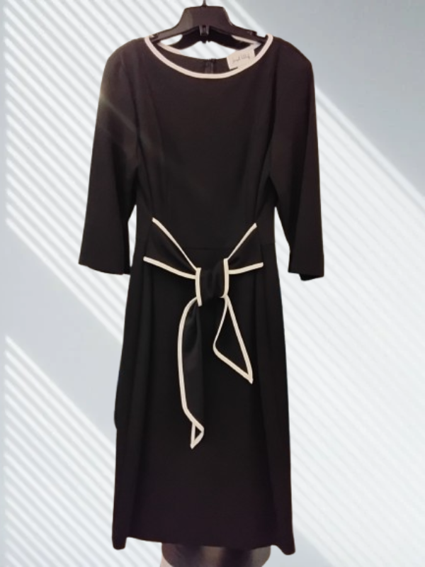 Black dress with a white bow tie