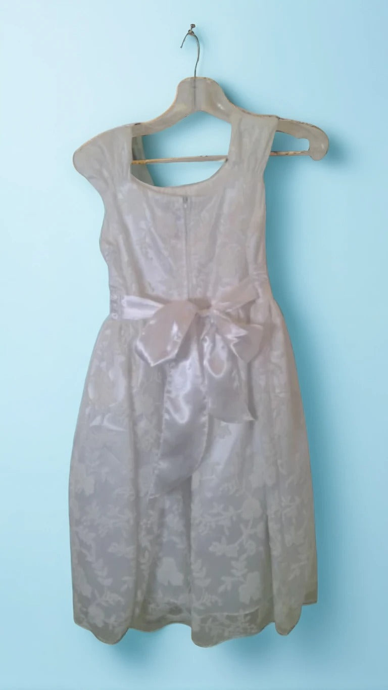 A smart, artistically patterned dress for a girl for any important event