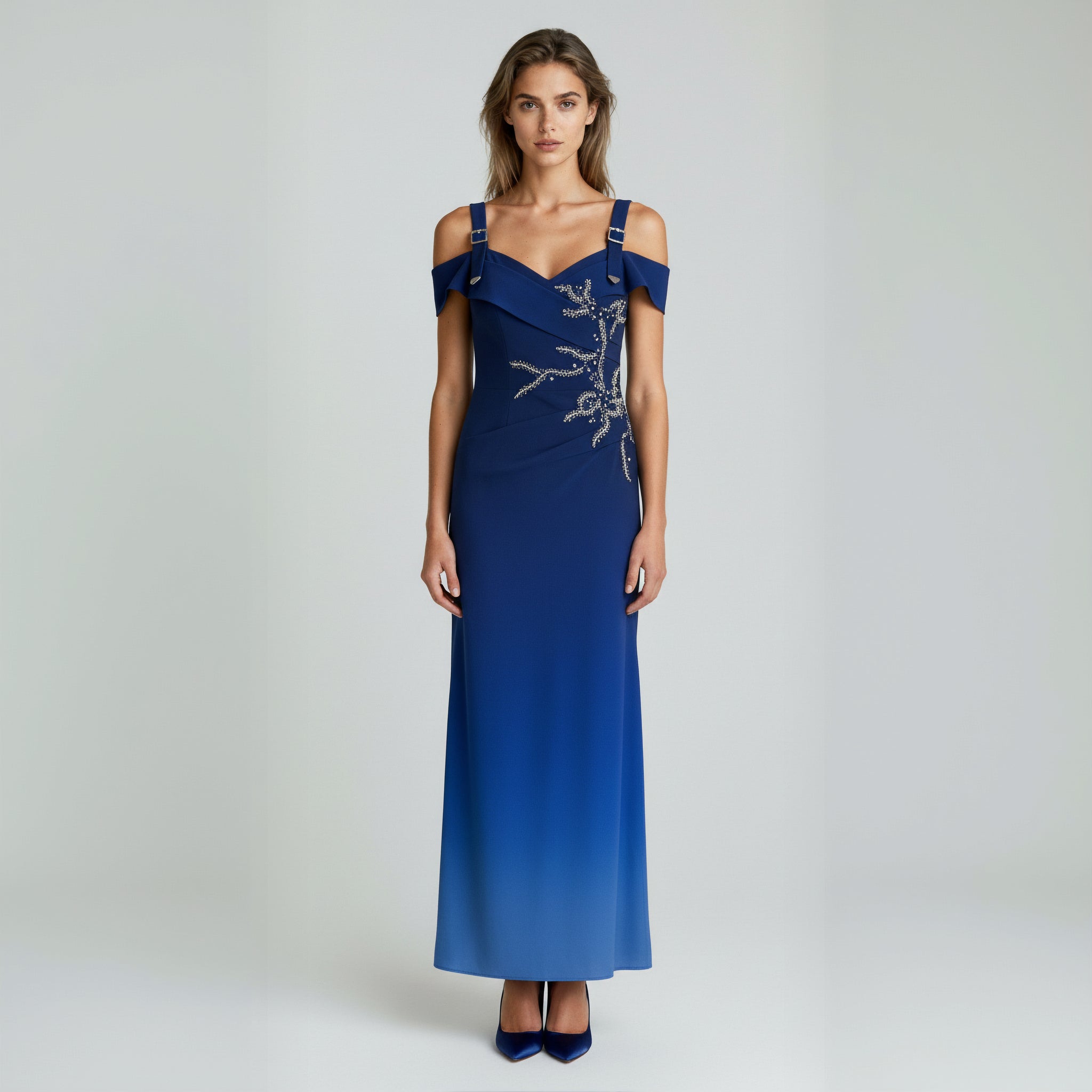 Blue evening gown with floral embellishments