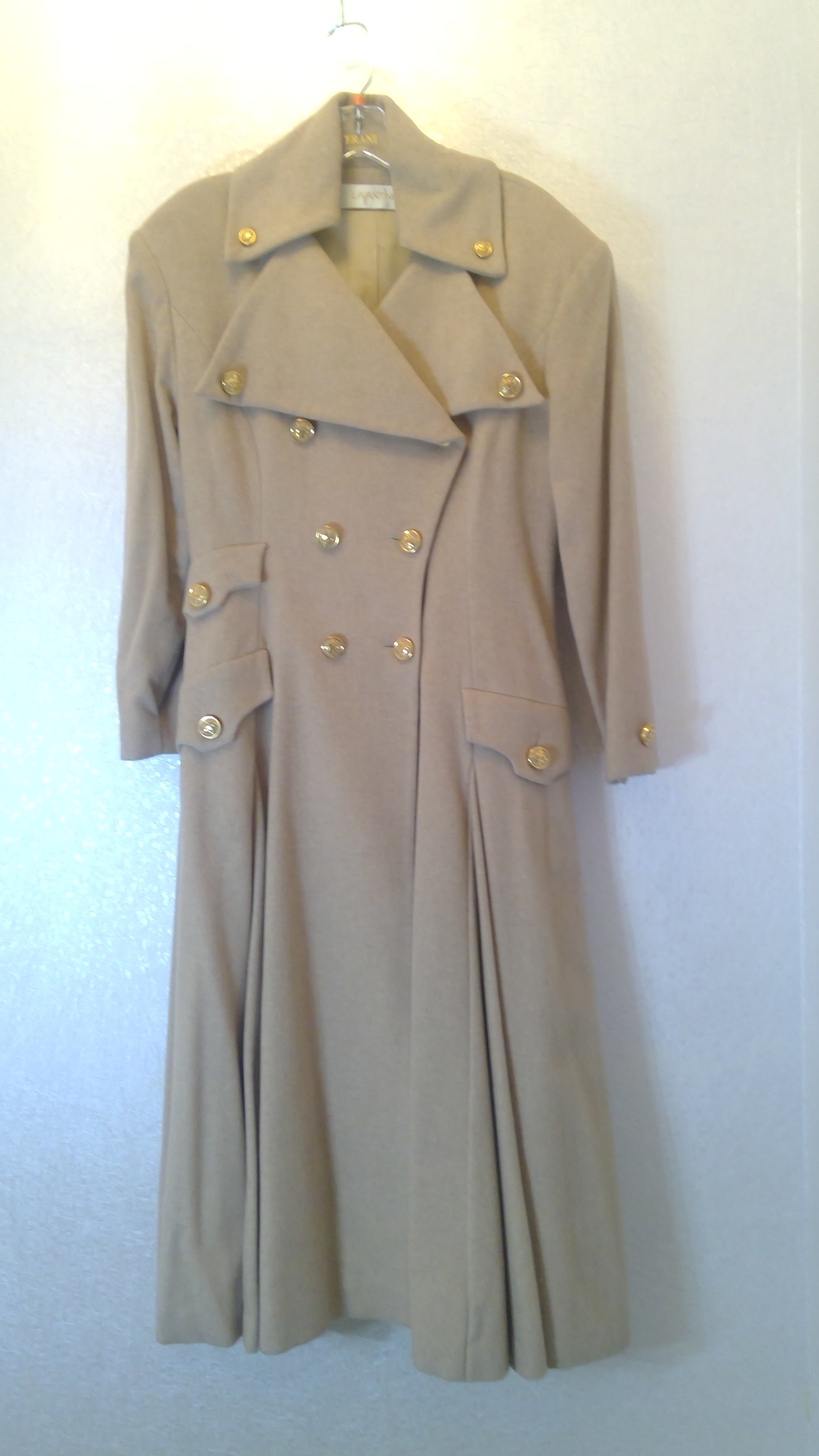 Beige coat with gold buttons