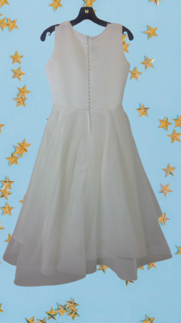 A smart, artistically patterned white dress for girl for any event