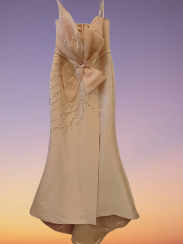 Beige dress with floral embellishments and large bow