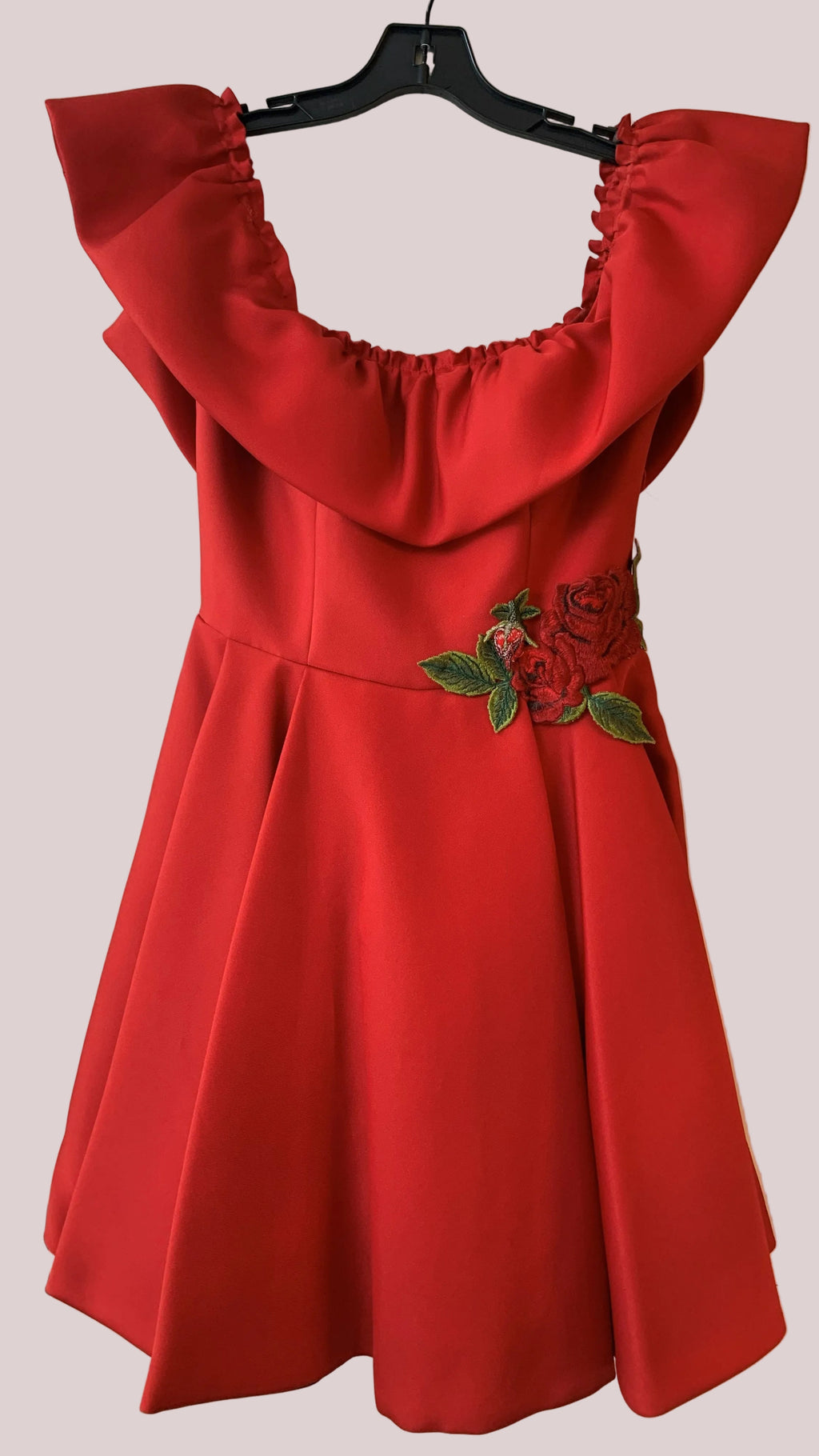 Red off-shoulder dress with a floral detai
