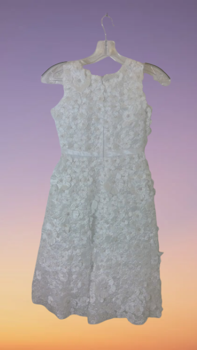 A smart, artistically patterned white dress for girl for any event