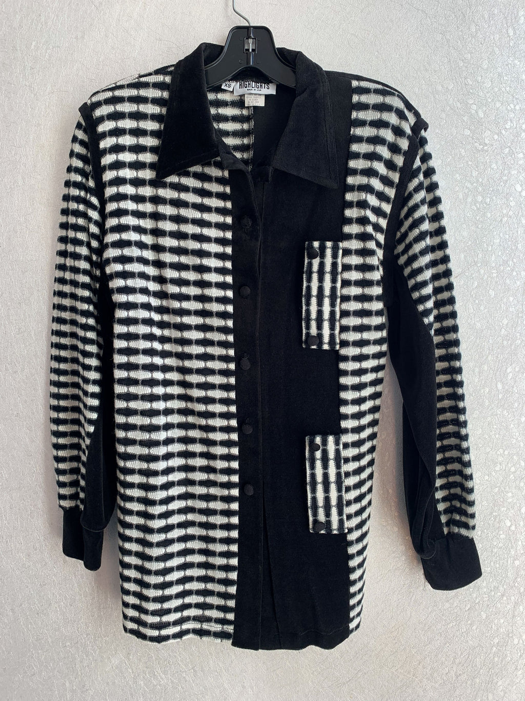 Black and white checkered jacket and black pants